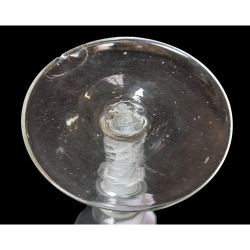 568 - AN ANTIQUE SWIRL STEM GLASS slight chip to base