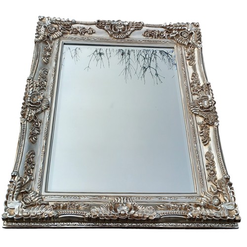 680C - A VERY ORNATE SILVER FRAMED MIRROR 35 x 46