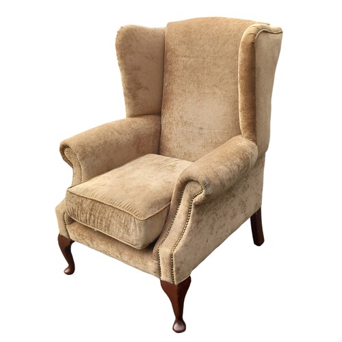 684B - AN OATMEAL COLOUR WINGBACK ARMCHAIR