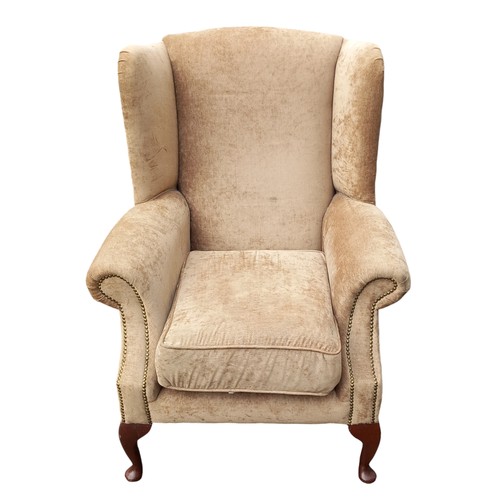 684B - AN OATMEAL COLOUR WINGBACK ARMCHAIR