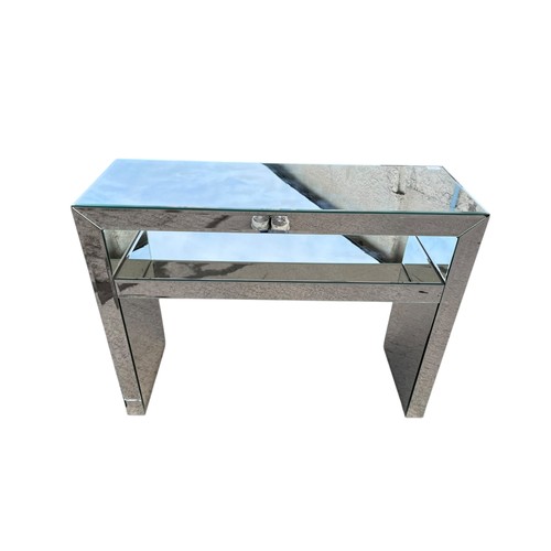 105 - A MIRRORED CONSOL TABLE (slight cracks in mirror)