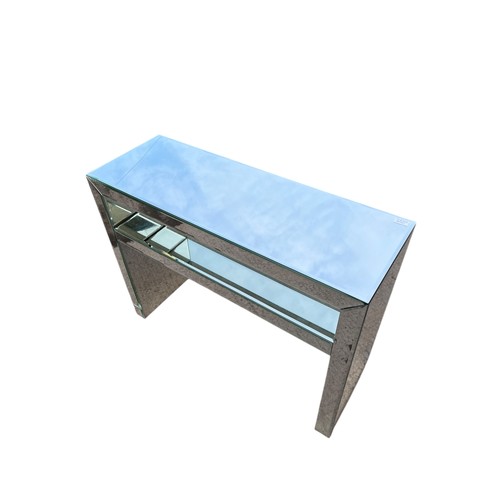 105 - A MIRRORED CONSOL TABLE (slight cracks in mirror)