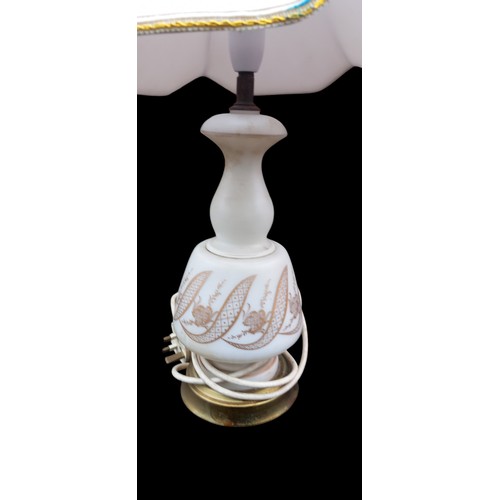 168 - AN ANTIQUE OPALINE STYLE GLASS LAMP WITH GILT OVERLAY