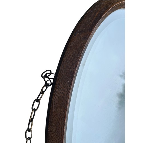 225 - AN ANTIQUE OAK FRAMED BEVELLED MIRROR 27x16