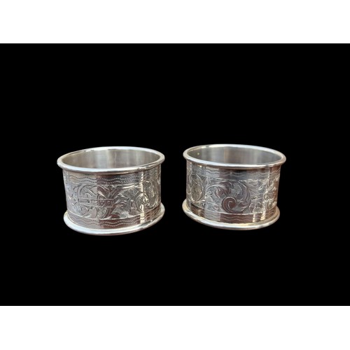 237 - A MATCHING PAIR OF ORNATE CHESTER SILVER NAPKIN RINGS