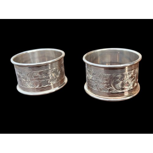 237 - A MATCHING PAIR OF ORNATE CHESTER SILVER NAPKIN RINGS