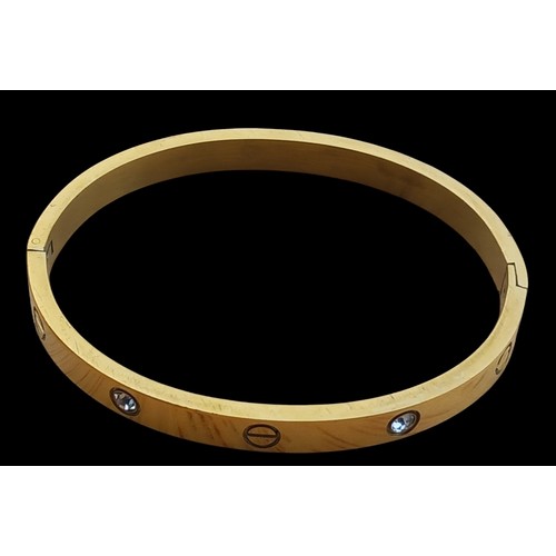 280 - GOLD TONE CRYSTAL AND SCREW DETAIL LOVE BANGLE