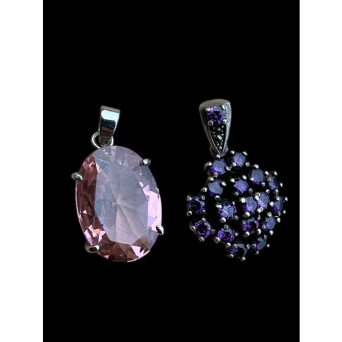 285 - AN 18ct WHITE GOLD PLATED PENDANT SET WITH PINK STONE AND 1 OTHER