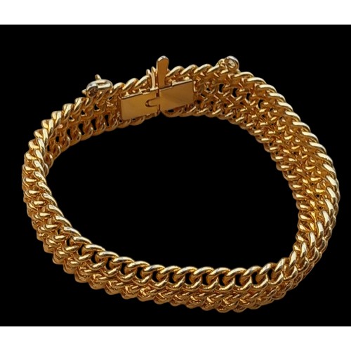 287 - GOLD TONE WOVEN BRACELET WITH SAFETY CHAIN