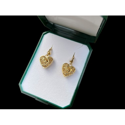 289 - A PAIR OF GOLD ON SILVER HEART SHAPED EARRINGS