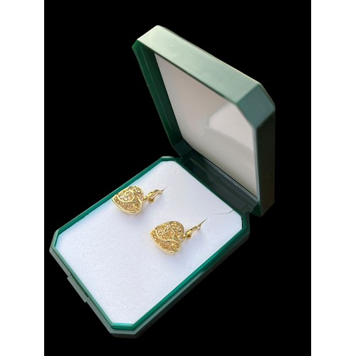 289 - A PAIR OF GOLD ON SILVER HEART SHAPED EARRINGS