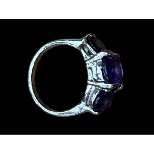 298 - A SILVER 3 STONE AMETHYST STYLE RING  SIZE O