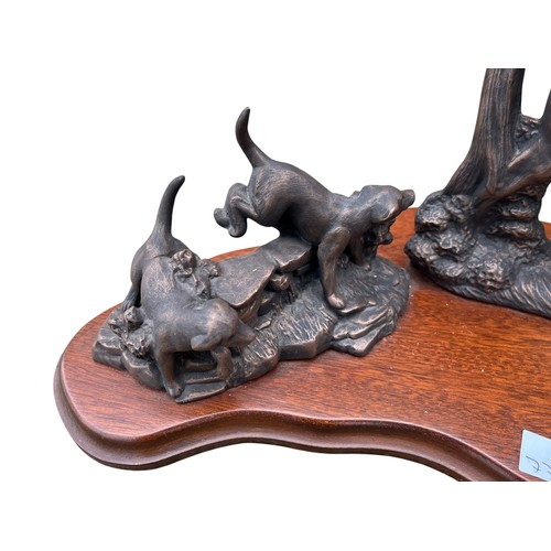 332 - A BRONZED METAL HUNT SCENE ON WOODEN BASE 20x12