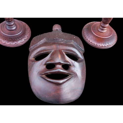 348 - AN AFRICAN MASK & 2 WOODEN CANDLESTICKS