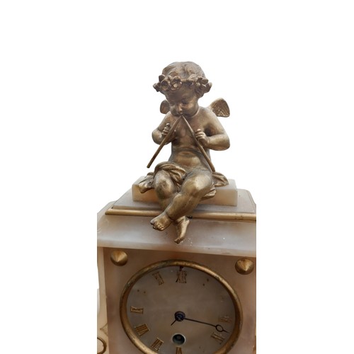 420 - A MARBLE CLOCK WITH GILT CHERUBS 10x11