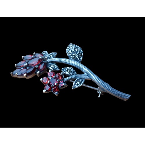 233 - SILVER MARCASITE AND GARNET FLORAL BROOCH