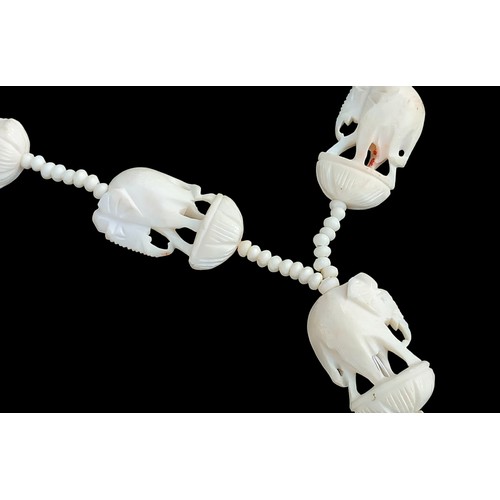 204 - A CARVED BONE ELEPHANT NECKLACE