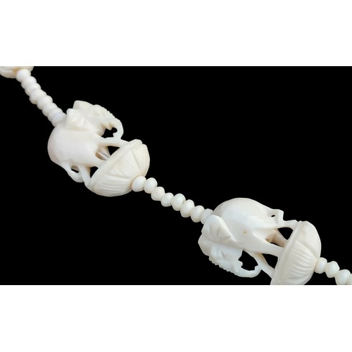 204 - A CARVED BONE ELEPHANT NECKLACE