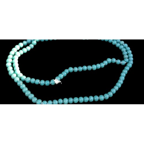 212 - A LONG JADE BEADED NECKLACE