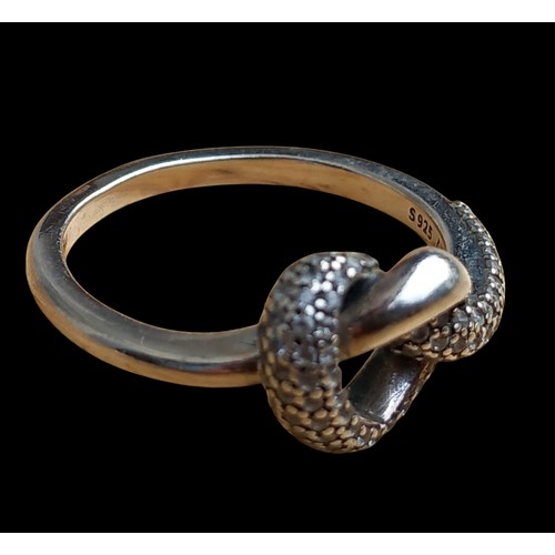 255 - A SILVER KNOT PANDORA GEM SET RING