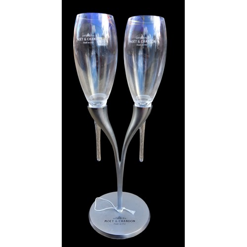 265 - A MOET AND CHANDON GLASS SET ON STAND