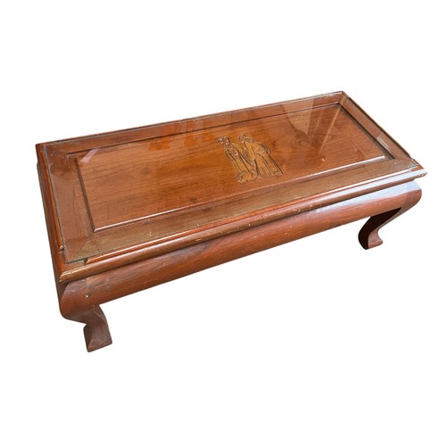 352 - ORIENTAL CARVED TABLE UNDER GLASS