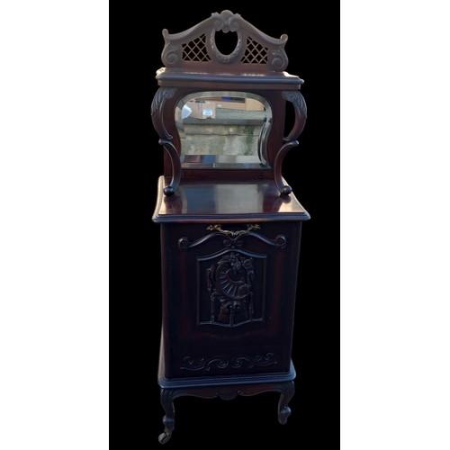 354 - A HEAVELY CARVED FALL FRONT COAL CABINET WITH SHOVEL AND MIRRORED BACK