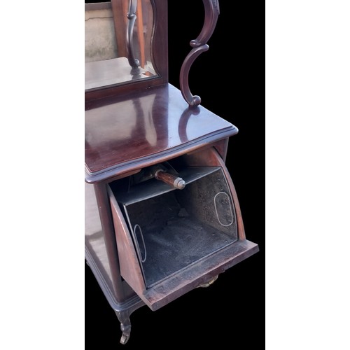 354 - A HEAVELY CARVED FALL FRONT COAL CABINET WITH SHOVEL AND MIRRORED BACK