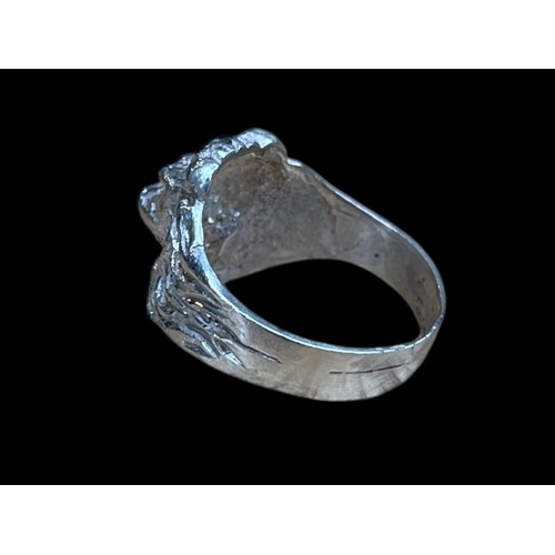 603 - A ROARING LION SILVER RING