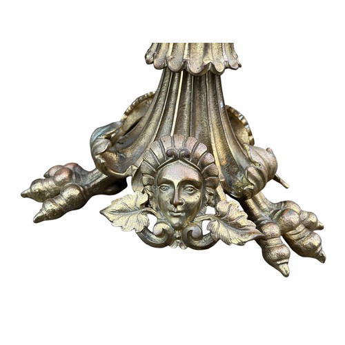 425A - AN ORNATE CLAW FOOTED BRASS CANDLELABRA