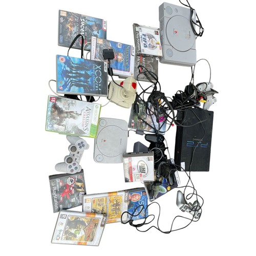 606A - A MIXED LOT OF GAMES TO INCLUDE PLAYSTION 1'S, A PLAYSTATION 2 ACCOMPANYING CONTROLLERS AND GAMES AN... 