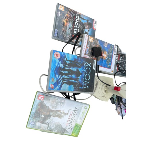 606A - A MIXED LOT OF GAMES TO INCLUDE PLAYSTION 1'S, A PLAYSTATION 2 ACCOMPANYING CONTROLLERS AND GAMES AN... 