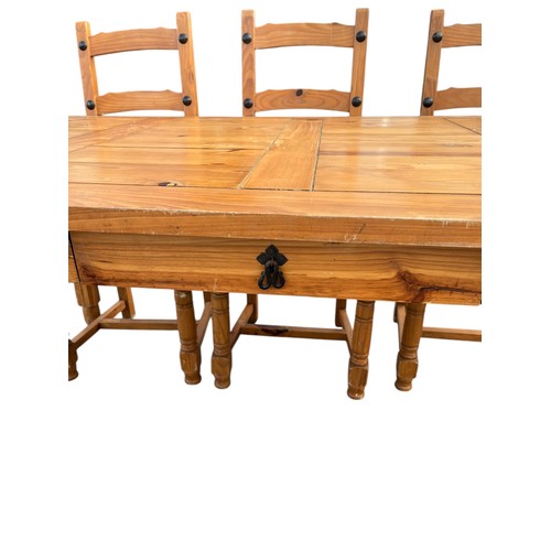 69 - A PINE TABLE AND 6 CHAIRS