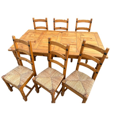 69 - A PINE TABLE AND 6 CHAIRS