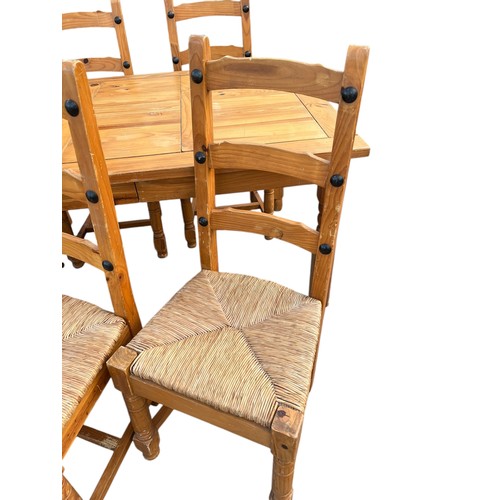 69 - A PINE TABLE AND 6 CHAIRS