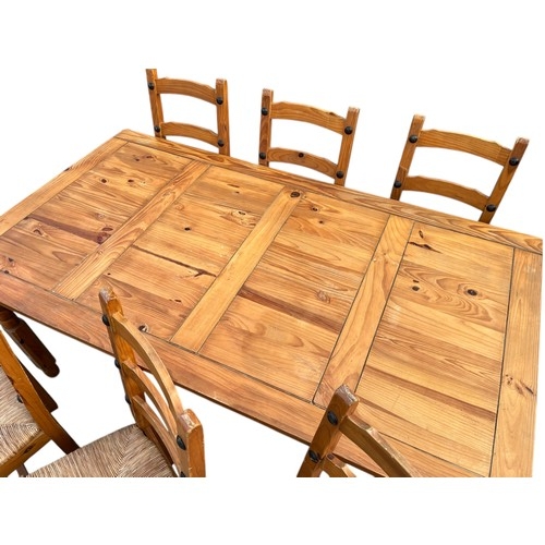 69 - A PINE TABLE AND 6 CHAIRS