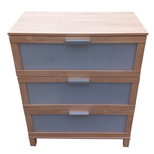 112 - A BEECH FINISHED CHEST OF DRAWERS WITH PLASTIC FRONTS