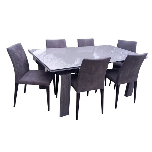 631 - AN EXTENDING GLASS TOP DINING TABLE WITH 6 GREY FINISH CHAIRS