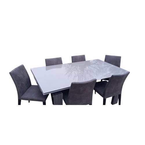 631 - AN EXTENDING GLASS TOP DINING TABLE WITH 6 GREY FINISH CHAIRS