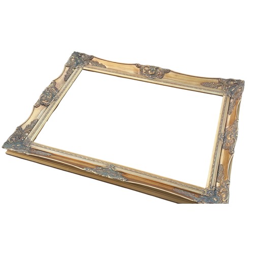 184 - LARGE MOULDED GILT PICTURE FRAME