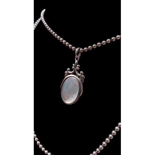 199 - SILVER SWIVEL JET/MOTHER OF PEARL FOB ON SILVER BALL CHAIN