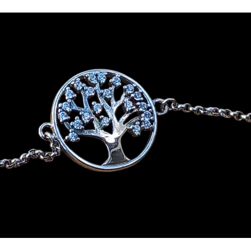 212 - AN ADJUSTABLE TREE OF LIFE SILVER BRACELET