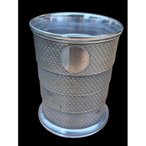 524 - A COLLAPSABLE PLATED TODDY CUP