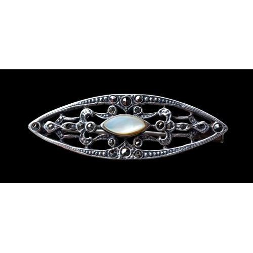 246 - A SILVER MOTHER OF PEARL & MARACASITE BROOCH