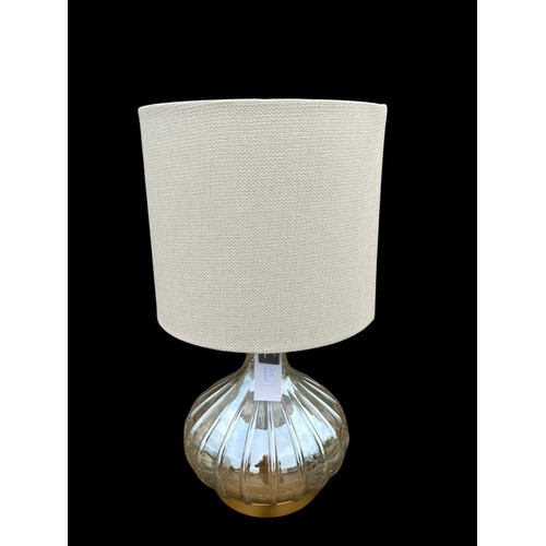 788 - A NEW BULBOUS RIBBED GLASS AND GILT TABLE LAMP WITH A LINEN FINISH SHADE 28