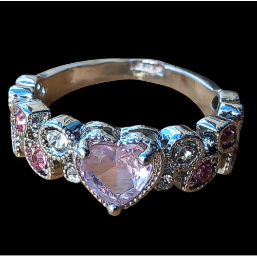 283 - A SILVER HEART & LEAF DESIGN RING WITH PINK/WHITE STONES