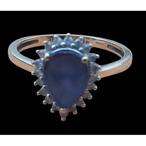 627 - A 9ct GOLD ORNATE BLUE STONE AND DIAMOND RING