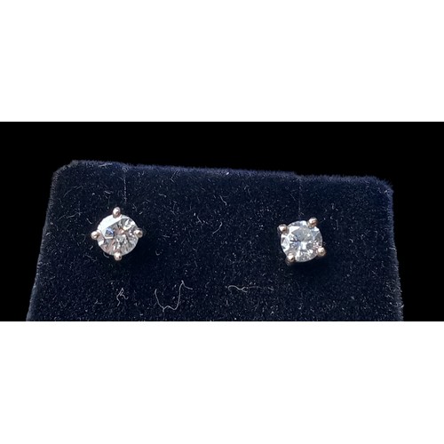 648 - A PAIR OF 18ct WHITE GOLD DIAMOND STUD EARRINGS (total 0.4grm) IN 4 CLAW MOUNTS WITH SCREW STEMS