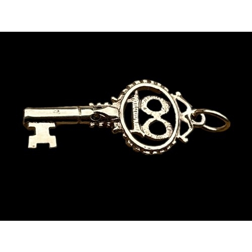 655 - A 9ct GOLD 18 KEY PENDANT/CHARM 1.8grm AND 29X12mm