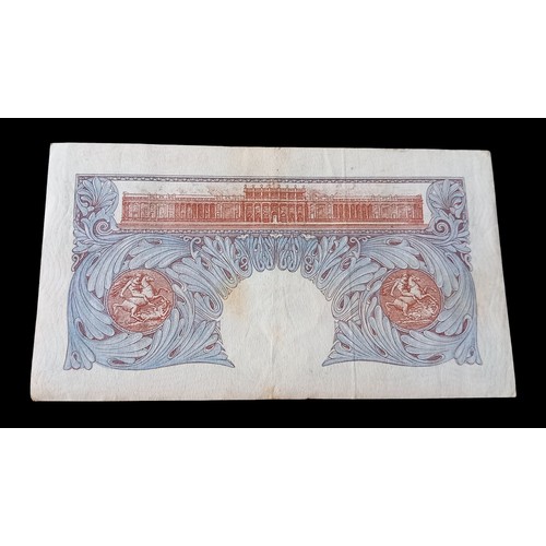 658 - A WW2 BANK OF ENGLAND £1 NOTE IN BLUE AND PINK THESE ARE THE 1st NOTES TO HAVE A METAL STRIP  ( TO P... 